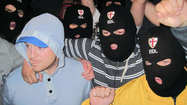 Far-right group, English Defence League leader, Tommy Robinson, left, with EDL supporters.