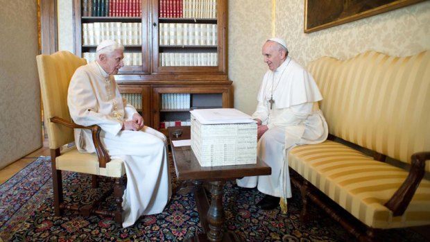 Pope Benedict XVI speaks to Pope Francis during a meeting in Castel Gandolfo.