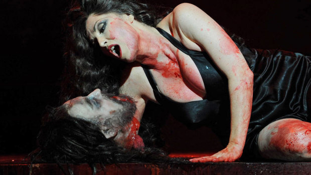 Cheryl Barker performs with the severed head of John the Baptist, during a full dress rehearsal for the Opera Australia production of Salome at the Sydney Opera House.
