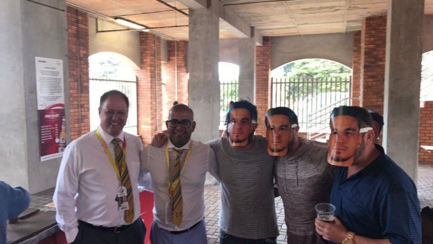 Embarrassing: Clive Eksteen and Altaaf Kazi posing with spectators wearing Sonny Bill Williams masks.