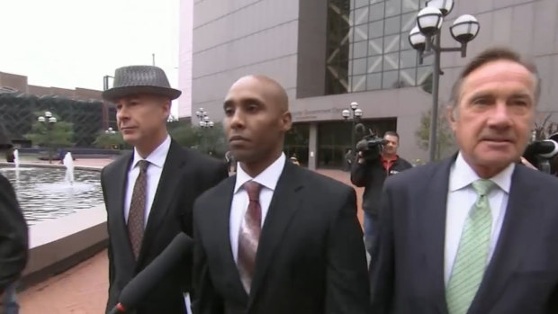 Minneapolis police officer Mohamed Noor, centre, has been charged with two counts of murder and one of manslaughter for killing Justine Ruszczyk Damond.