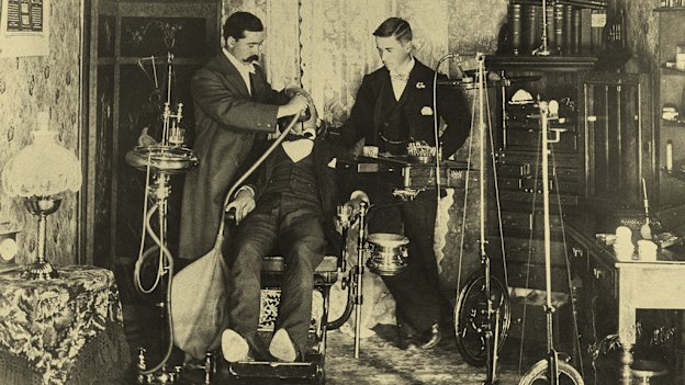 A dentist and his assistant prepare a patient in the country town of Colac in Victoria at the turn of last century.