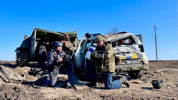 Darren Conway (left) filming on the frontline in Kharkiv.