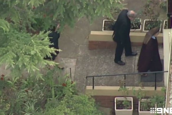 Pell is seen entering the Carmelite Monastery in Kew, Melbourne.