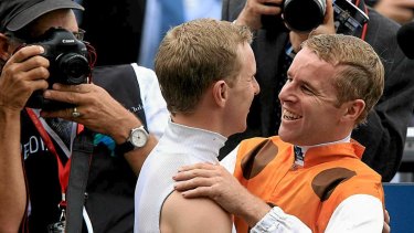 Brothers in arms: Tommy Berry, right, is congratulated by twin brother  Nathan after winning the 2013 Golden Slipper.