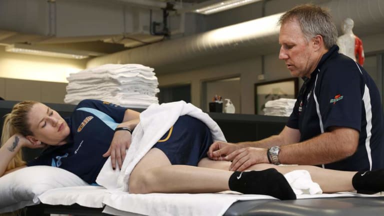 Jackson is treated by physiotherapist Tony Ward.