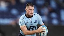 Henry O'Donnell of the Waratahs runs with the ball.