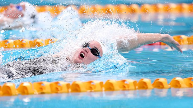 Iona Anderson competes in the women's 100m backstroke final.