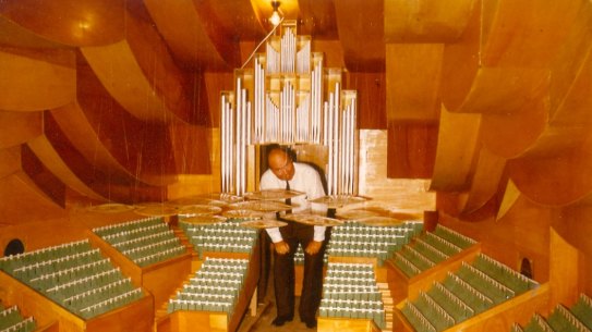Photograph of Dr Vilhelm Jordan in a model of the Concert Hall dated 13 November 1981. 