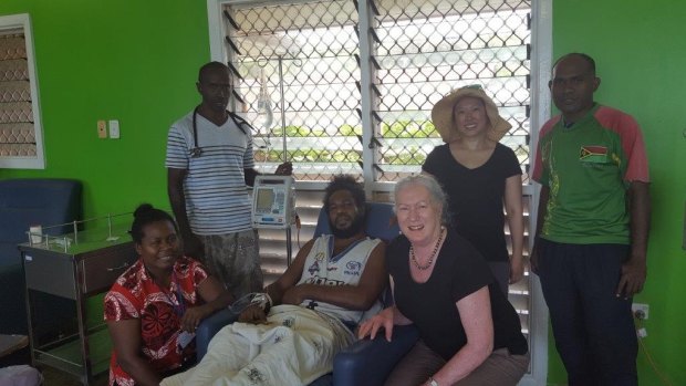 The team treating the 34-year-old patient at the hospital in Honiara, Solomon Islands. From left: nurse Meltus, Dr Andrew Soma, the patient, Wendy Spencer, Beth Hua and nurse Stephen.