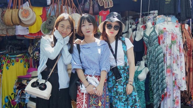 Chen Lizhu with her friends at Tanah Lot Temple in Bali.