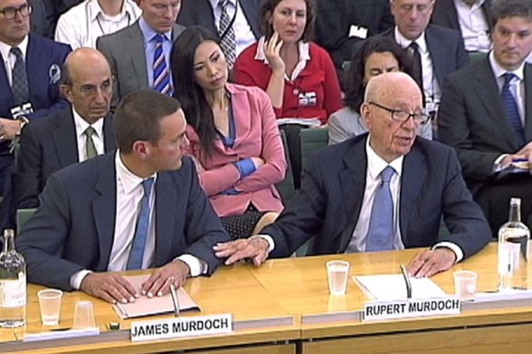James and Rupert Murdoch appear before a British parliamentary committee on phone hacking in July 2011.