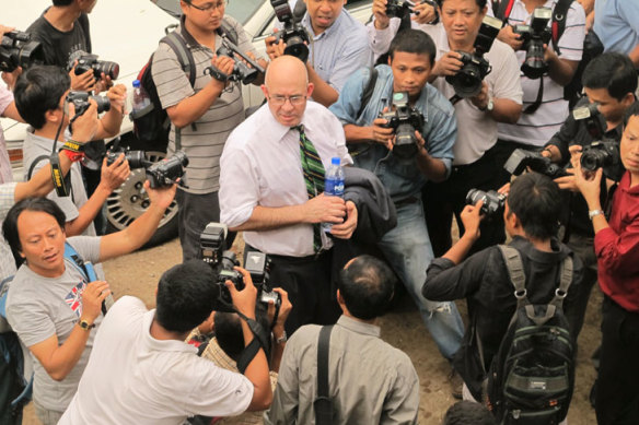 Dunkley faces reporters in Yangon before being jailed. 
