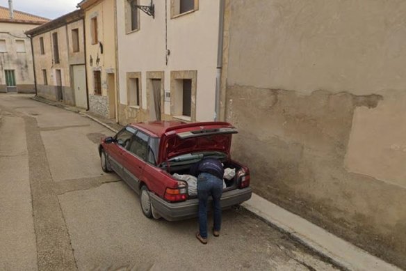 One of the images released by Google wher<em></em>e a man is seen loading a large bundle into a car.
