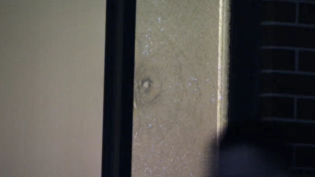 The home was sprayed with bullets, waking the sleeping occupants inside. 