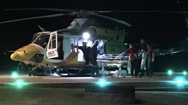 The RACQ CQ Rescue helicopter lands at Mackay Base Hospital with the shark attack victim.