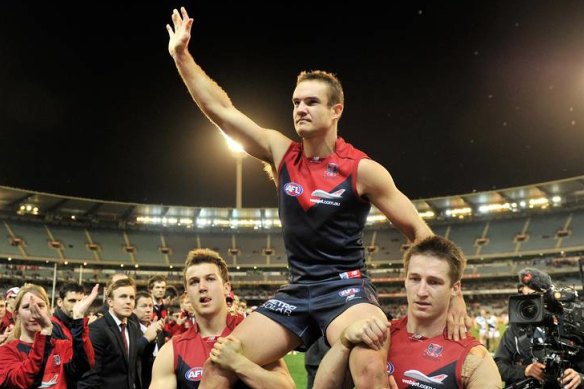 Brad Green after playing his last game is chaired off the MCG by his Melbourne team mates.
