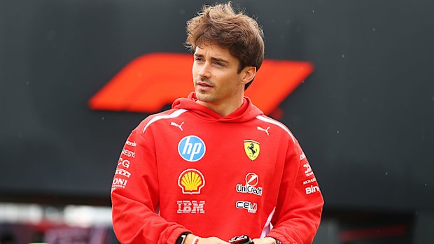 A man in a red Ferrari jumper. 