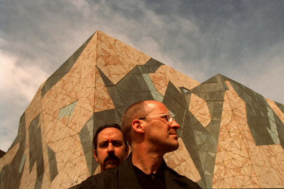 Architects Donald Bates, rear, and Peter Davidson in front of Federation Square in 2002.