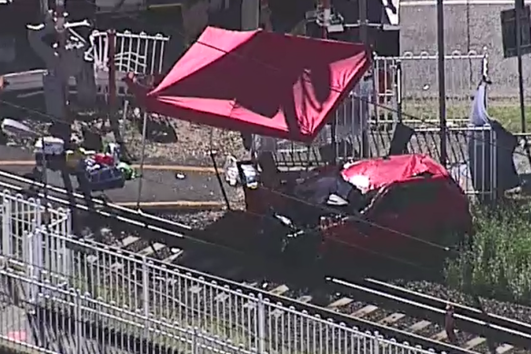 Aerial shot of the collision between a train and a car at Lindum Train Station.