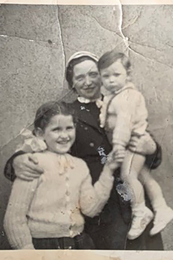 Joan Burton with her adoptive mother and brother. When she tried to find her birth mother, one nun – who knew her identity – refused, telling her to “go home”.