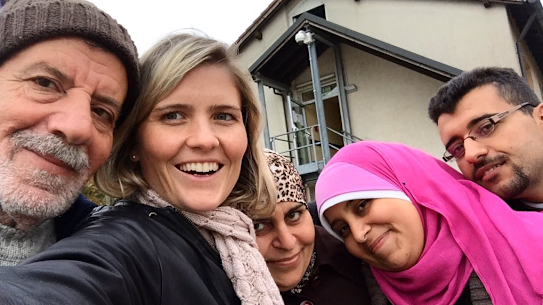 Sophie McNeill with Syrian refugee Nazieh Husein and his family, reuinted and safe in Germany. 