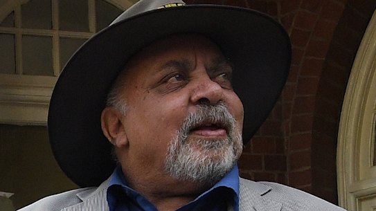 Aboriginal elders Uncle Greg Simms, centre, and Uncle Wes Marne, left, conduct a smoking ceremony to mark the opening of the Youth Koori Court at Surry Hills.