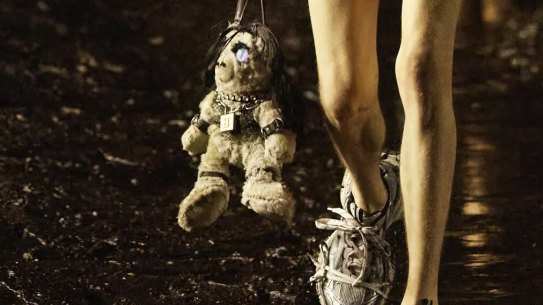 A model carrying a BDSM teddy bear bag as featured in the controversial advertising campaign now withdrawn by the brand.