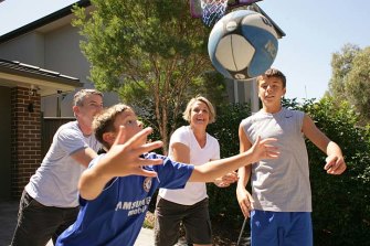 Kristina Keneally playing basketball with husband, Ben and sons, Daniel (12) and Brendan (10, blue shirt) at their Pagewood home in 2011.