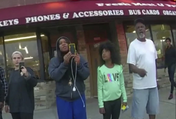 Darnella Frazier (second left), seen in an image from a police body camera, filming the murder of George Floyd.