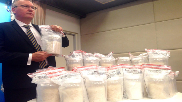 Detective Superintendent Kim Massam with the seized drugs.