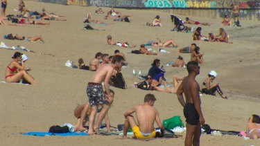 Dozens of people have been spotted at St Kilda beach, despite social distancing rules.