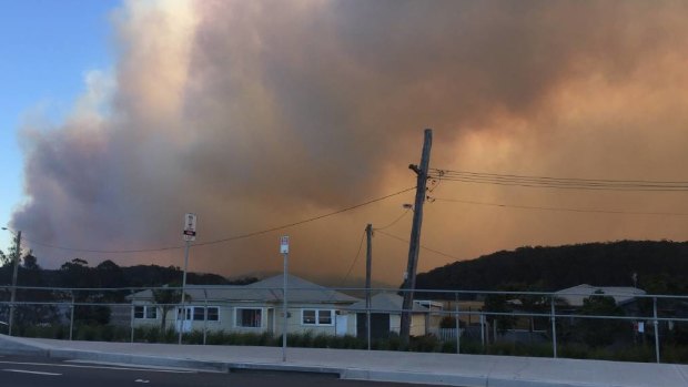 A bushfire burns in Milton near Ulladulla on the NSW South Coast. 