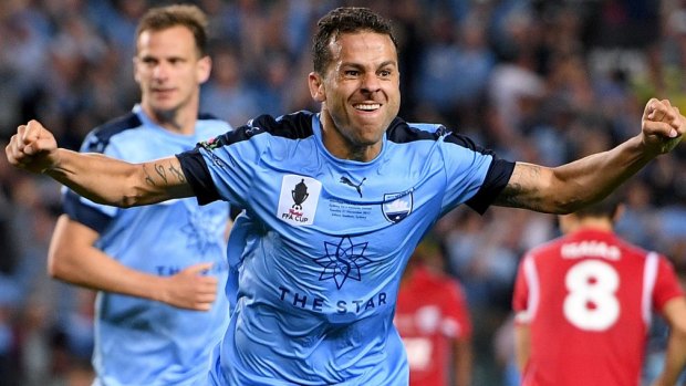 Sharpshooter: Bobo scores the winner in the FFA Cup final against Adelaide.
