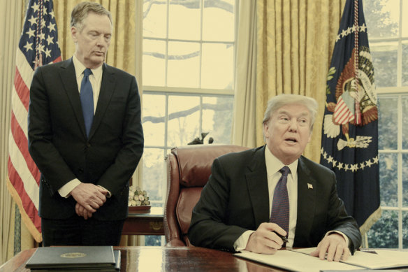 Trump signs an order in 2018 to put tariffs on washing machines and solar panels.