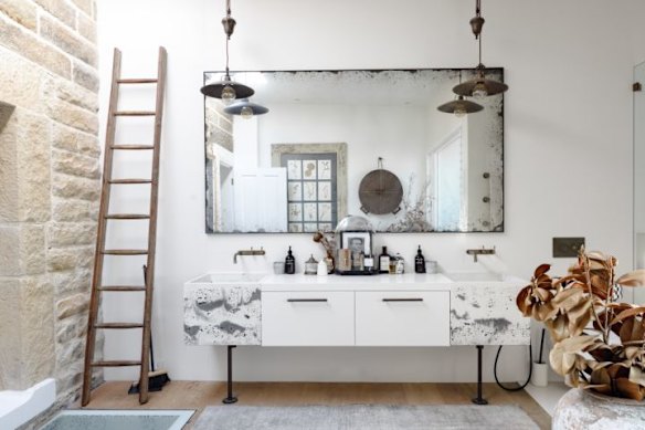 The second bathroom has echoes of the past found in its sandstone walls, contrasted by modern comforts.