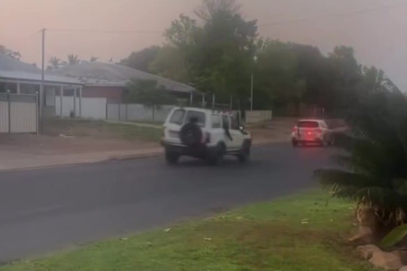A still from vision of a police car being chased by a 4WD in Kununurra.