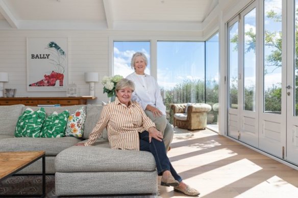 Glenda (seated) and Jennifer left teaching to start their renovation business.