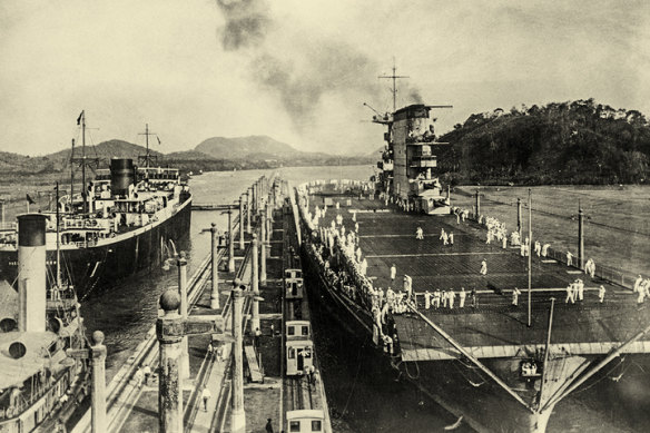 US Navy crew on the aircraft carrier USS Lexington (CV-2) in the Miraflores Locks on the Panama Canal c 1930.