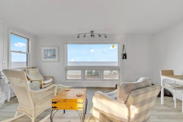 A picture window frames the sea views.