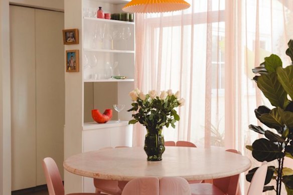 Morley’s love of pink extends to a pink marble dinner table. 