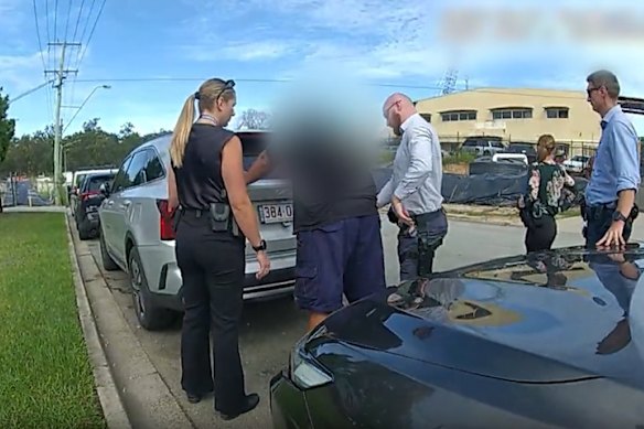 Image taken from police body camera footage of the 42-year-old driver of the Ford Ranger being arrested. 