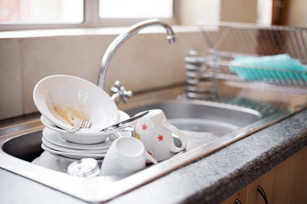 Shot of kitchen sink full of dirty dishes