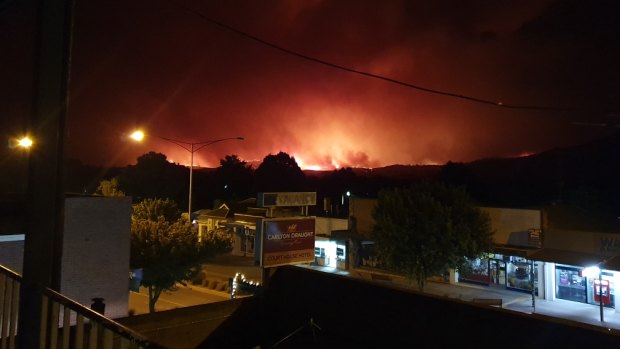 Photos taken from the balcony of the Courthouse Hotel of fire moving towards Corryong earlier this week. 