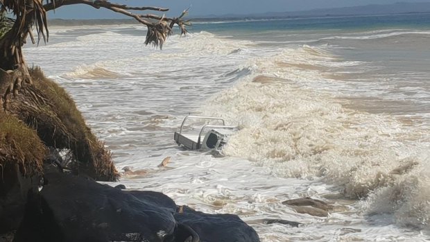 A ute was caught in the big swell near Mudlo Rocks at Rainbow Beach.
