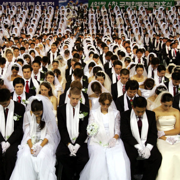 More than 4000 couples get married in a ceremony arranged by the Reverend Sun Myung Moon’s Unification Church in South Korea in 2005.