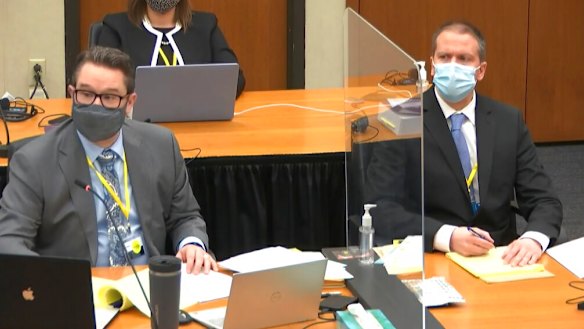 Defence attorney Eric Nelson, left, and defendant former Minneapolis police Officer Derek Chauvin.