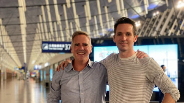 ABC correspondent Bill Birtles and Australian Financial Review reporter Michael Smith leaving China.