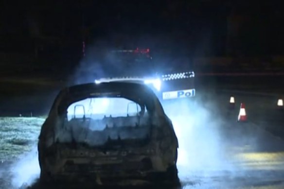 The burning shell of a car was the only thing that remained after firefighters' fire on Gormon Boulevard.