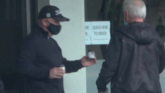 Surveillance photos capture former V/Line boss James Pinder (left) and Transclean boss George Haritos (right) meeting at a Williamstown cafe in August.